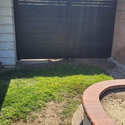 Fantastic Vinyl Fencing - Black aluminum privacy fence with accent top.