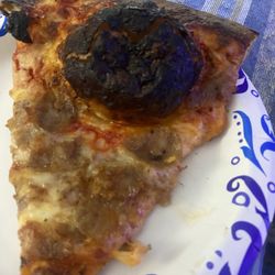 Mamma Mia Pizzeria - Burnt slice of pizza