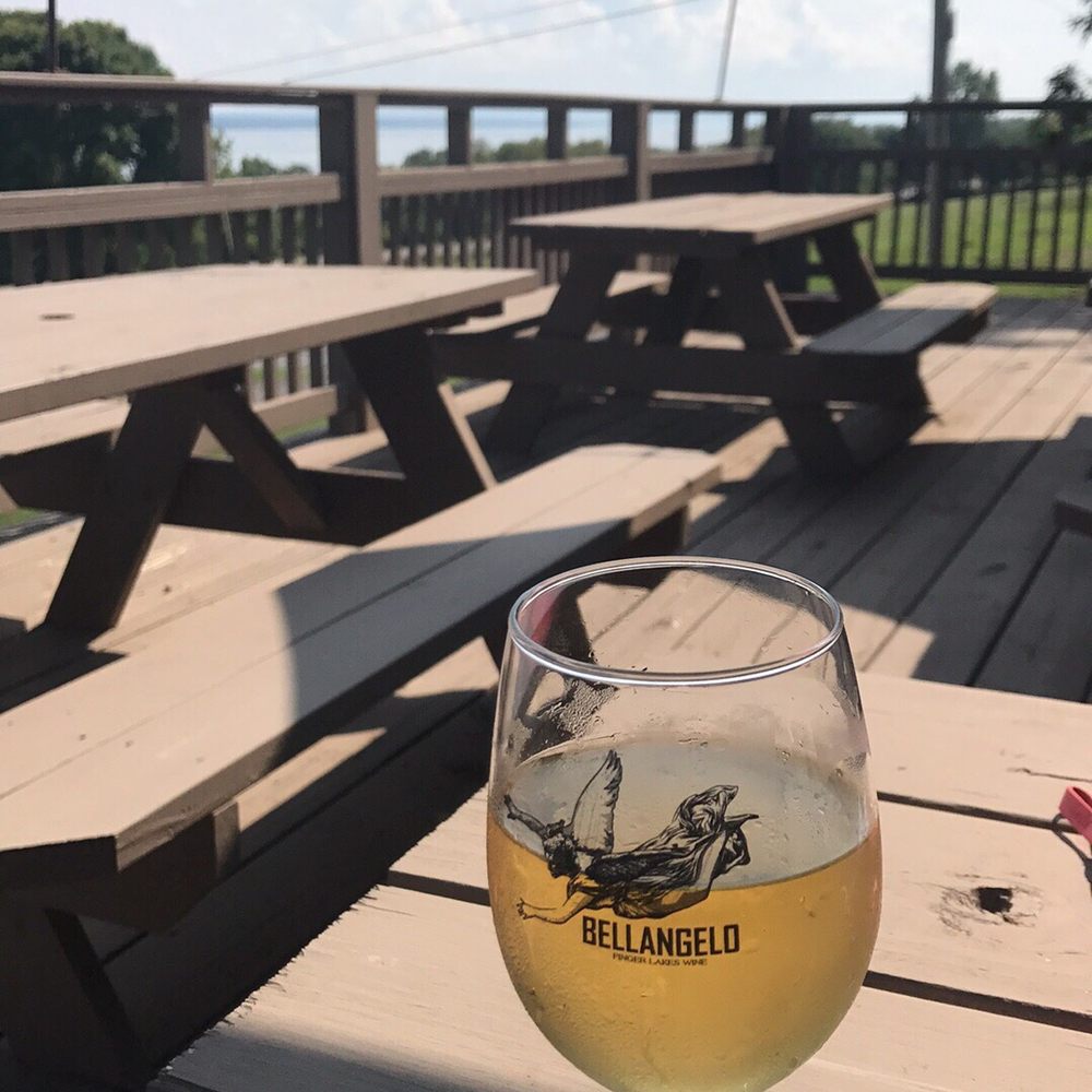 Bellangelo North - a glass of beer on a picnic table - Wine Tasting Room Near Me - Geneva, New York