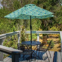 Rio Sierra River Resort - The Panorama Room's private river deck with umbrella and bistro table