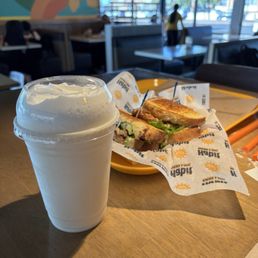 Grilled chicken sandwich and vanilla milkshake. Grilled chicken sandwich and vanilla milkshake.