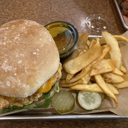 Fowl and hog -fried chicken sandwich with pork belly
