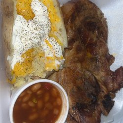 IronHorse Barbeque & Catering - Pork steak dinner, baked beans (delicious) baked potato I seasoned and added cheese. $13 with tax. Not bad at all