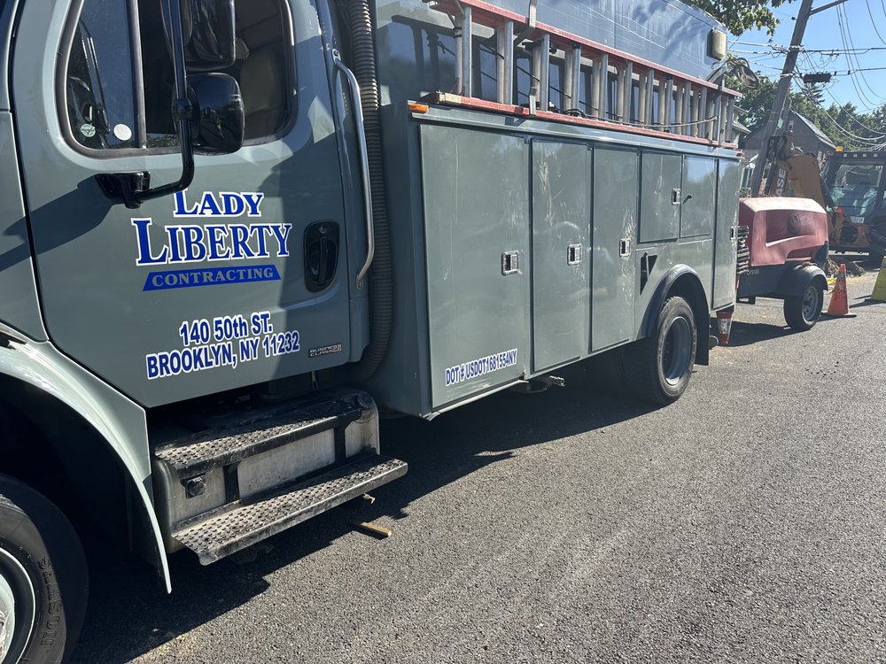 Slide of Lady Liberty Contracting