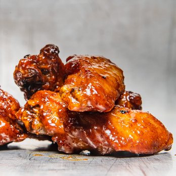 Wing Squad - a pile of chicken wings - Food Delivery Services Near Me Wing Squad - a pile of chicken wings - Food Delivery Services Near Me