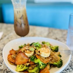 Simply Fresh Thai - Pad See Ew with Shrimp. (You're able to pick your own protein when choosing these main dishes)   And Thai Iced Coffee... so damn good.