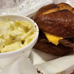 Brisket & beer cheese sandwich on a pretzel bun with Mac n cheese Brisket & beer cheese sandwich on a pretzel bun with Mac n cheese
