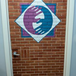 Holistic Touch - Hand painted mural of Holistic Touch logo