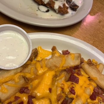 Texas Roadhouse - Smothered chicken with loaded fries - Steakhouses Near Me - Albuquerque, New Mexico Texas Roadhouse - Smothered chicken with loaded fries - Steakhouses Near Me - Albuquerque, New Mexico