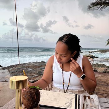 Ama Cane Bay - This is how close we were to the water. My wife ordered a coconut cocktail before being seated. - Seafood Near Me - St. Croix, Virgin Islands