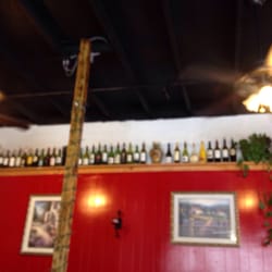 La Vita Italian - Wine bottles around the room