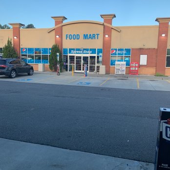 bp - a food mart with a parking meter in front of it - Gas Stations Near Me - Charlotte, North Carolina