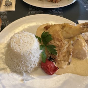 Les Deux Magots - My sexy chicken dish, consumed with gusto! Free range chicken with lemongrass in butter sauce (of course) and rice pilaf! - French Near Me - Paris, 75