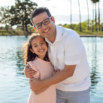 Janet Garcia Photography - dad with the middle child - Event Photography Near Me Janet Garcia Photography - dad with the middle child - Event Photography Near Me