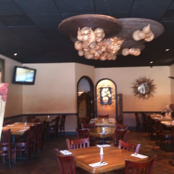El Tarasco - Chic main diningroom at El Tarasco with tasteful objets d'art & avant garde chandelier. - Mexican Near Me - Sylmar, California