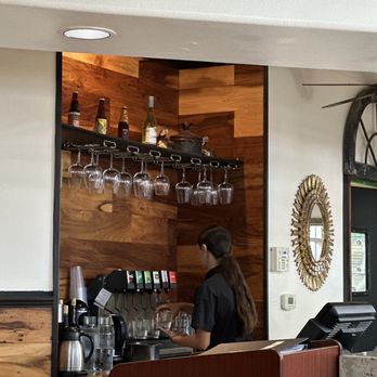 Inkas - a woman behind a counter at a restaurant - Peruvian Near Me - Irvine, California Inkas - a woman behind a counter at a restaurant - Peruvian Near Me - Irvine, California