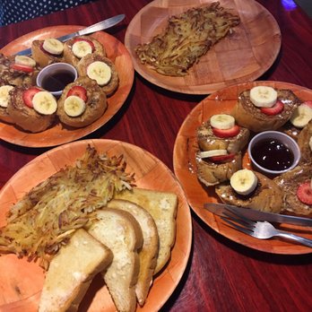 Cafe Single Fin - French toast with bananas and strawberries. Side of grits and buttered toast. - Coffee & Tea Near Me - Pensacola, Florida Cafe Single Fin - French toast with bananas and strawberries. Side of grits and buttered toast. - Coffee & Tea Near Me - Pensacola, Florida