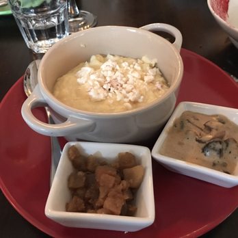 Tryzub Ukrainian Kitchen - Polenta and cheese with house bacon nibs and mushroom gravy. Delicious - Ukrainian Near Me - Chicago, Illinois