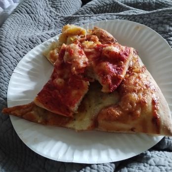 Ocean View Pizzaria - a slice of pizza on a paper plate - Pizza Near Me - Ocean View, Hawaii Ocean View Pizzaria - a slice of pizza on a paper plate - Pizza Near Me - Ocean View, Hawaii