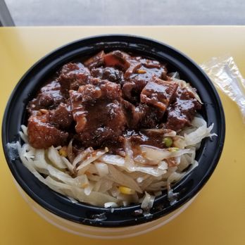 Golden Krust - Oxtail stew with cabbage only. No rice. 9 bucks. Delicious! - Caribbean Near Me - White Plains, New York