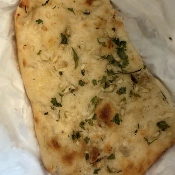 Intalia - Garlic Naan - (takeout) perfect to pair with any entree - Indian Near Me - Stevensville, Michigan Intalia - Garlic Naan - (takeout) perfect to pair with any entree - Indian Near Me - Stevensville, Michigan