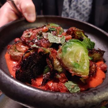 Garrison - Charred brussel sprouts in a yummy harissa sauce - New American Near Me - Austin, Texas