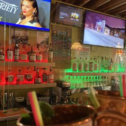 a view of the bar and televisions
