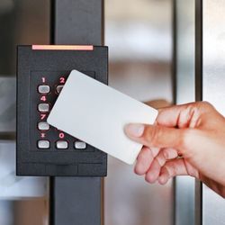 Michael's Keys Locksmith - Woman using an access key card from Michael's Keys for secure entry at a facility in Fort Worth, TX.