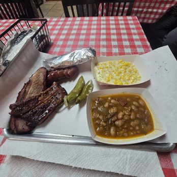 El Monte BBQ - Two plate brisket and pork ribs with charro beans, flour tortilla, and cream corn. Add a sausage for a total of $30. - Barbeque Near Me - San Antonio, Texas El Monte BBQ - Two plate brisket and pork ribs with charro beans, flour tortilla, and cream corn. Add a sausage for a total of $30. - Barbeque Near Me - San Antonio, Texas
