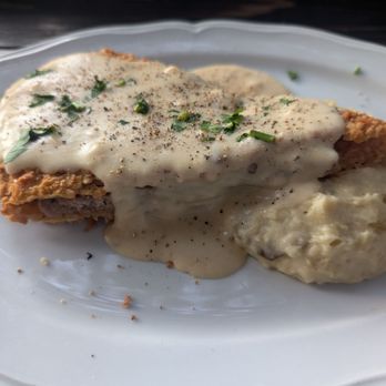 Moonshine Grill - Half of a chicken fried steak (pepper added by me) - Southern Near Me - Austin, Texas Moonshine Grill - Half of a chicken fried steak (pepper added by me) - Southern Near Me - Austin, Texas