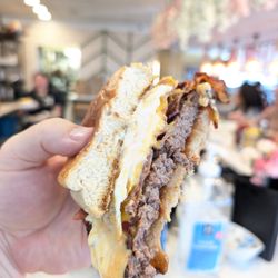Dear Dad’s - The Breakfast Burger cut in half to show the delicious layers