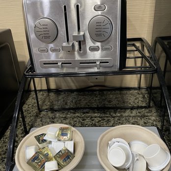 Comfort Inn Guilford Near I-95 - Breakfast area: toaster, butter, and cream cheese spread - Hotels Near Me - Guilford, Connecticut
