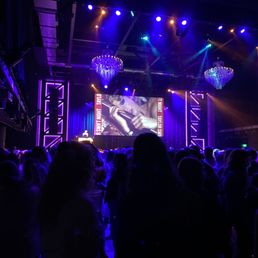 a crowd of people at a concert a crowd of people at a concert