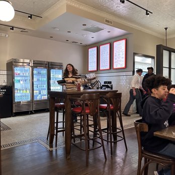 The Rex Burger & Lobster - group of people in a restaurant - American Near Me - Mineola, New York The Rex Burger & Lobster - group of people in a restaurant - American Near Me - Mineola, New York