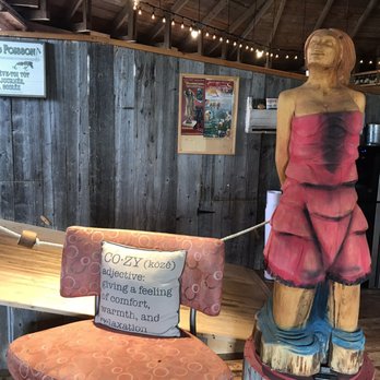 La Queue De Homard - a wooden statue of a woman - Seafood Near Me - Saint-Jean-Port-Joli, Quebec