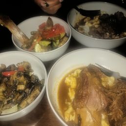 Slow braised beef ribs, sauteed garlic mushrooms, and sauteed vegetables.