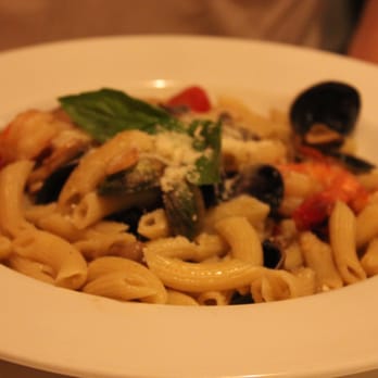Il Villagio - a plate of pasta with mussel and vegetables - Italian Near Me - Malverne, New York Il Villagio - a plate of pasta with mussel and vegetables - Italian Near Me - Malverne, New York
