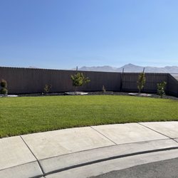 Planet Earth Garden Services - Front landscaping with grass and sprinklers installed