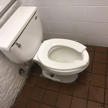 Crawfish Hole - a toilet in a stall - Seafood Markets Near Me - Natchitoches, Louisiana