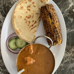 Chicken tikka masala with grilled corn. Chicken tikka masala with grilled corn.