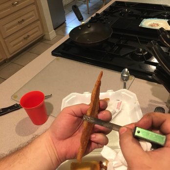 Bobby's Homestyle Cooking - a person cutting a piece of bacon - New American Near Me - Nederland, Texas Bobby's Homestyle Cooking - a person cutting a piece of bacon - New American Near Me - Nederland, Texas