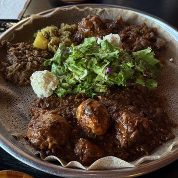 Enssaro Ethiopian Restaurant - MEAT Sampler for one and Doro Wot ( CHICKEN STEW ) - Ethiopian Near Me - Oakland, California Enssaro Ethiopian Restaurant - MEAT Sampler for one and Doro Wot ( CHICKEN STEW ) - Ethiopian Near Me - Oakland, California
