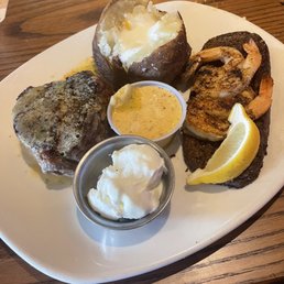 Filet with grilled shrimp and baked potato Filet with grilled shrimp and baked potato