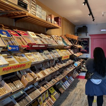 Havana Leaf & Vine - a woman looking at cigars - Beer, Wine & Spirits Near Me - Stockton, California Havana Leaf & Vine - a woman looking at cigars - Beer, Wine & Spirits Near Me - Stockton, California