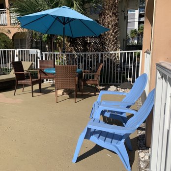 Echo Sails Motel - Seating area around swimming pool - Hotels Near Me - Clearwater Beach, Florida