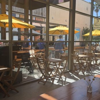 HomeState - They have a patio that wraps the entire building in L shape with umbrellas and also shade in pergola - Tex-Mex Near Me - El Segundo, California HomeState - They have a patio that wraps the entire building in L shape with umbrellas and also shade in pergola - Tex-Mex Near Me - El Segundo, California