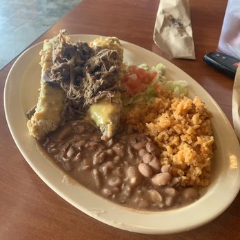 Bandolero Brewery - Amazing Relleno topped with pork and sides of Mexican rice, beans and lettuce/tomato. - Breweries Near Me - Clovis, New Mexico