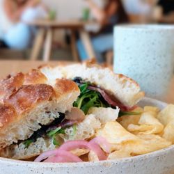 Surf Camp Coffee - Prosciutto sandwich on foccacia bread and a genmai cha