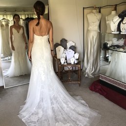 Sylvia's beautiful work - she took in the sides, shortened the train and the straps and added a bustle. Sylvia's beautiful work - she took in the sides, shortened the train and the straps and added a bustle.