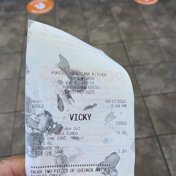 Popeyes Louisiana Kitchen - a hand holding a receipt - Fast Food Near Me - Perris, California Popeyes Louisiana Kitchen - a hand holding a receipt - Fast Food Near Me - Perris, California